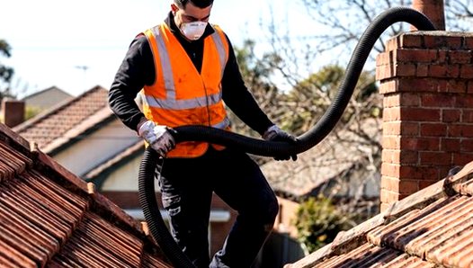 Vacuum hose run along a roof ridge line